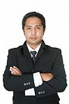 Portrait Of A Confident Businessman With Folded Arms Stock Photo