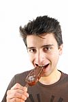Portrait Of A Cute Young Man Eating An Ice-cream Stock Photo