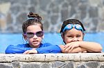 Portrait Of Two Little Girls In The Pool Stock Photo