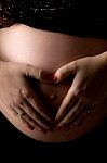 Pregnant Woman Shows Heart Symbol Stock Photo