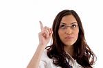 Pretty Female Wearing Spectacles Pointing Upwards Stock Photo