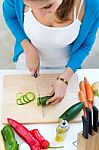 Pretty Young Woman Cooking At Home Stock Photo