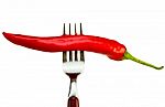 Red Chilli With Steel Fork Stock Photo