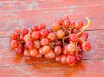 Red Grapes On The Wooden Table  .  Stock Photo