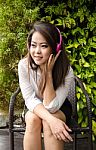 Relax Business Woman Listening The Music Through Headphones Stock Photo