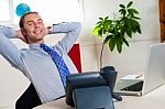 Relaxed Entrepreneur In Office Stock Photo