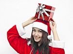 Santa Claus Hat With Red Christmas Gift Box Stock Photo