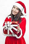 Santa Claus Hat With Red Christmas Gift Box Stock Photo