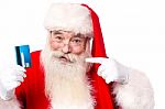 Santa Claus Showing  Credit Card Stock Photo