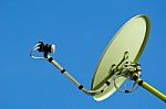 Satellite Dish And Blue Sky Stock Photo