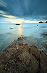 Seascape Sunsset With Fantastic Rock Surface Stock Photo