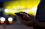 Selective Focus Hand Holding Phone On Night Stock Photo
