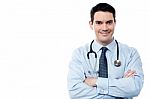 Senior Smiling Male Doctor At Work Stock Photo