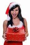 Sexy Santa Claus Helper Girl With A Gift Stock Photo