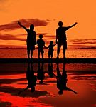Silhouette Family At Beach Stock Photo