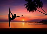 Silhouette Of Yoga Girl at Sunset Stock Photo