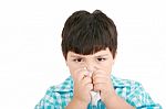 Small Boy Blowing Nose Stock Photo