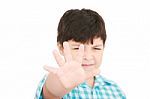 Small Boy Showing Stop Signal Stock Photo