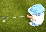 Small Child Playing Golf Stock Photo