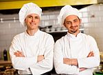 Smart And Confident Male Chefs Stock Photo