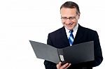 Smart Businessman Holding A Open File Stock Photo