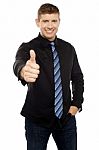 Smart Young Executive Showing Thumbs Up Stock Photo