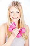 Smiled Woman Holding Two Weights Stock Photo