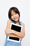 Smiling Asian Girl Holding Tablet Stock Photo