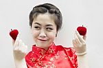 Smiling Beautiful Chinese Woman Holding A Strawberry And An Appl Stock Photo