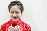 Smiling Beautiful Chinese Woman Staring At The Rose Stock Photo