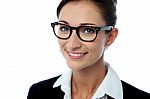 Smiling Bespectacled Corporate Woman Stock Photo