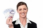 Smiling Business Woman Holding Money Stock Photo