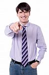 Smiling Businessman Pointing At You Stock Photo