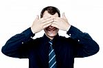 Smiling Businessman Put His Hands Over Eyes Stock Photo