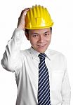 Smiling Engineer Put Hand On Helmet Stock Photo