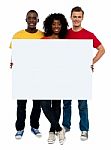 Smiling Friends Holding blank board Stock Photo