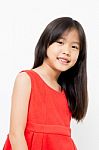 Smiling Little Asian Girl In Red Dress Stock Photo