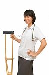 Smiling Medical Doctor Holding Crutches Stock Photo