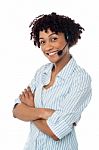 Smiling Woman In Hands Free Headset Device Stock Photo