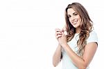 Smiling Woman With Clasped Hands Stock Photo