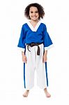 Smiling Young Girl In Karate Uniform Stock Photo