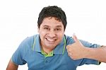 Smiling Young Man With Thumbs Up Stock Photo