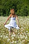 smiling young Woman In Meadow Stock Photo