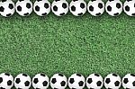 Soccer Balls On Green Grass Stock Photo
