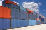 Stack Of Cargo Containers At Container Yard With Cloud Stock Photo
