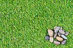 Stone On Grass Background Stock Photo