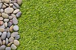 Stone On Grass Background Stock Photo