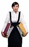 Stressed Businesswoman With Document Folders Stock Photo