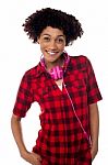Stylish Teenager With Headphones Around Her Neck Stock Photo