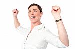 Successful Businesswoman With Clenched Fists Stock Photo